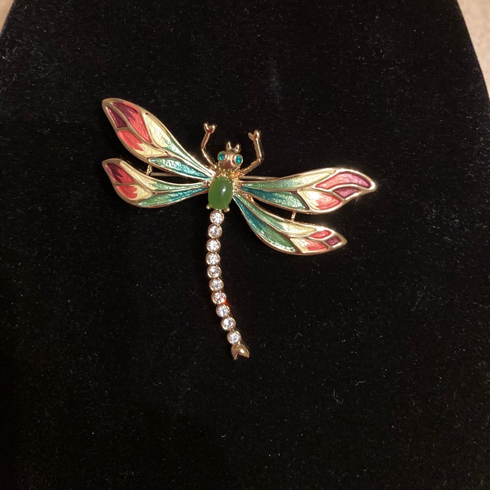 Dragonfly brooch with jade gemstone.